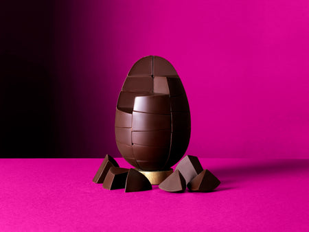 Unpackaged Colombian Single Origin chocolate Egg on a rich purple background